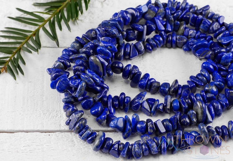 Handcrafted Lapis Lazuli chip necklace. These genuine, natural, tumbled chips, are drilled, and strung on elastic cord to create an endless necklace. This gemstone necklace is blue, weighs around 80 grams, and is approximately 34 inches in length.