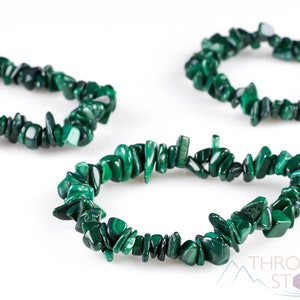 Handcrafted Malachite chip bracelet. These green, tumbled chips, are drilled, and strung on an elastic cord, to create an endless bracelet. Each crystal bracelet is unique in shape, and color, and has a wrist circumference of approximately 6 inches.