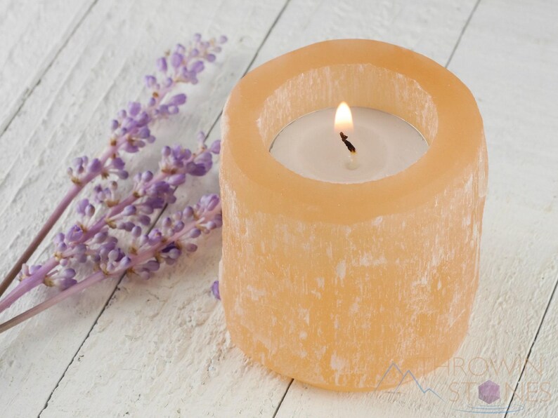 These peachy orange Selenite crystal carved raw cylindrical votive candle holders range in a variety of sizes.  
Crystals are nature-made therefore each one is unique in appearance.
