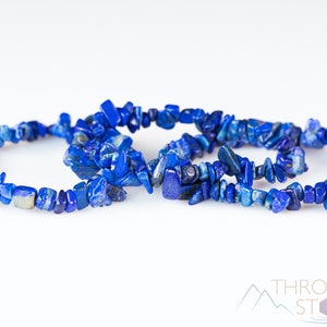 Handcrafted Lapis Lazuli chip bracelet. These blue, tumbled chips, are drilled and strung on an elastic cord. Each crystal bracelet is unique in shape, color, and pattern and has a wrist circumference of approximately 6 inches. Listing has variations