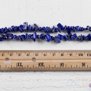 Handcrafted Lapis Lazuli chip necklace. These genuine, natural, tumbled chips, are drilled, and strung on elastic cord to create an endless necklace. This gemstone necklace is blue, weighs around 80 grams, and is approximately 34 inches in length.