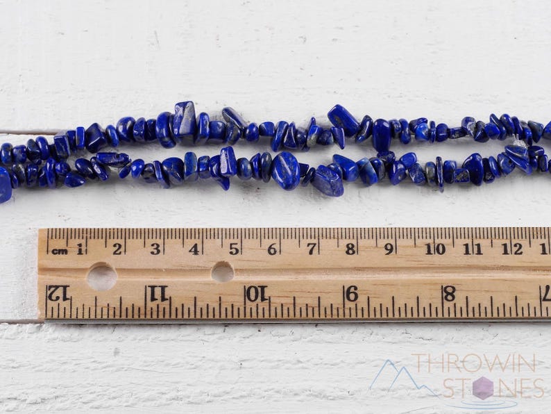 Handcrafted Lapis Lazuli chip necklace. These genuine, natural, tumbled chips, are drilled, and strung on elastic cord to create an endless necklace. This gemstone necklace is blue, weighs around 80 grams, and is approximately 34 inches in length.
