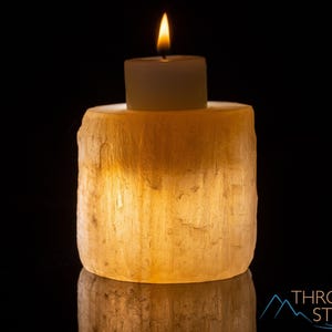 These peachy orange Selenite crystal carved raw cylindrical votive candle holders range in a variety of sizes.  
Crystals are nature-made therefore each one is unique in appearance.