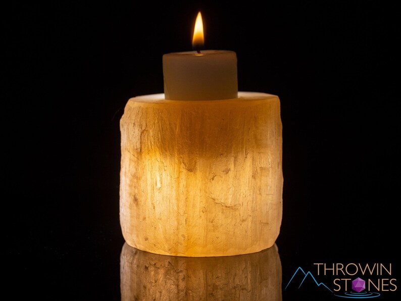 These peachy orange Selenite crystal carved raw cylindrical votive candle holders range in a variety of sizes.  
Crystals are nature-made therefore each one is unique in appearance.