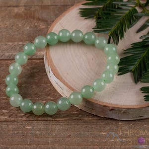 These pastel green Aventurine crystal bracelets have sphere beads strung on elastic for an endless bracelet. 
Crystals are nature-made therefore each one is unique in appearance.