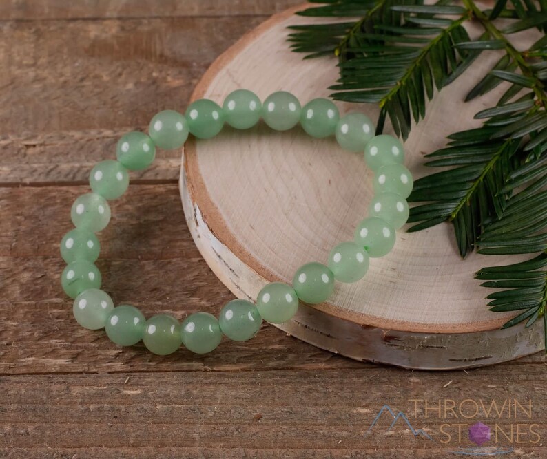These pastel green Aventurine crystal bracelets have sphere beads strung on elastic for an endless bracelet. 
Crystals are nature-made therefore each one is unique in appearance.