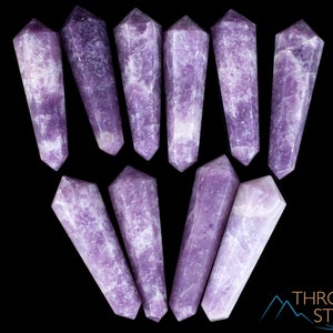 These Lepidolite crystal carved polished double terminated points range in a variety of handheld sizes.  Lepidolite  is mottled light to dark pinkish purple with white splotches.
Crystals are nature-made therefore each one is unique in appearance.