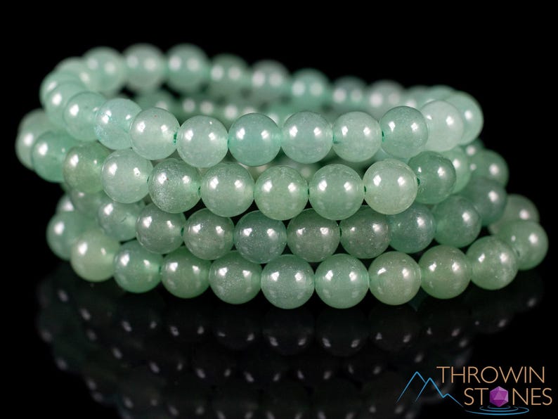 These pastel green Aventurine crystal bracelets have sphere beads strung on elastic for an endless bracelet. 
Crystals are nature-made therefore each one is unique in appearance.
