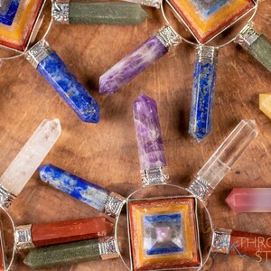 These crystal carved polished generators are a rainbow chakra crystal pyramid surrounded by 7 small points in each color of the rainbow chakras.
Crystals are nature-made therefore each one is unique in appearance.