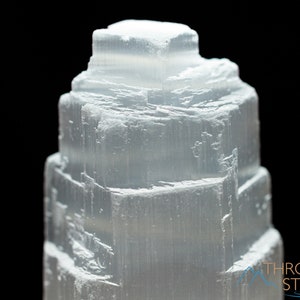 These white Selenite crystal carved raw tiered towers range in a variety of handheld sizes.  
Crystals are nature-made therefore each one is unique in appearance.