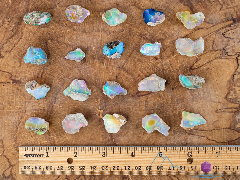 These raw Opal crystals are chunk shaped and rainbow colored with patches of tan matrix.
Crystals are nature-made therefore each one is unique in appearance.