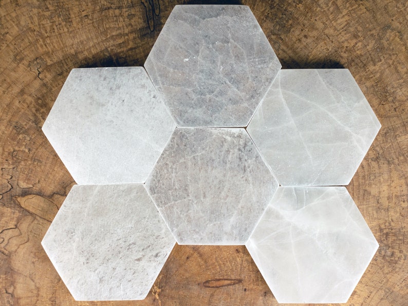 These are white Selenite crystal carved polished hexagon plates.
Crystals are nature-made therefore each one is unique in appearance.