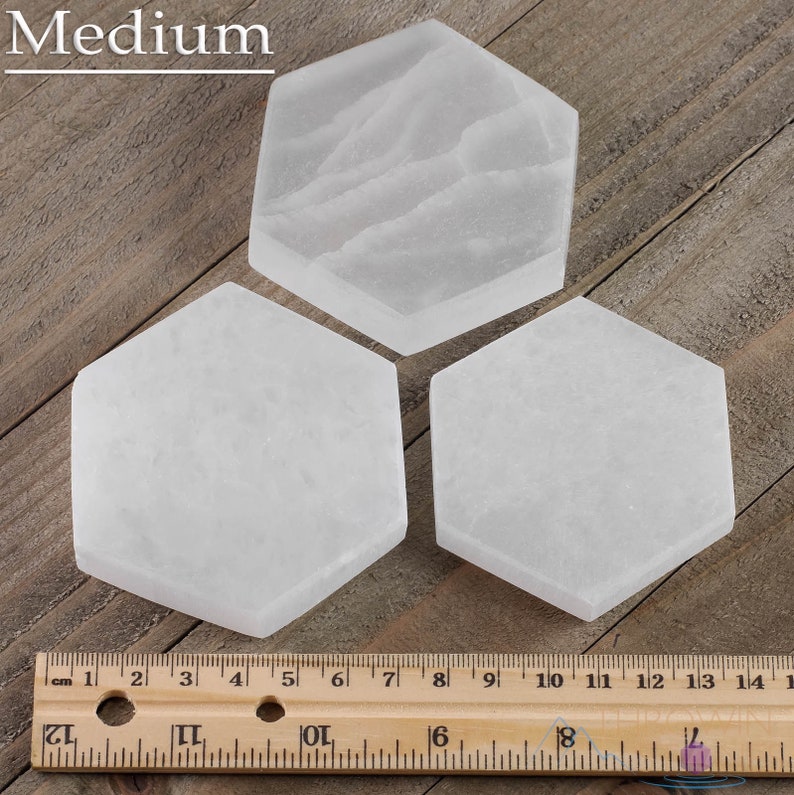 These are white Selenite crystal carved polished hexagon plates.
Crystals are nature-made therefore each one is unique in appearance.