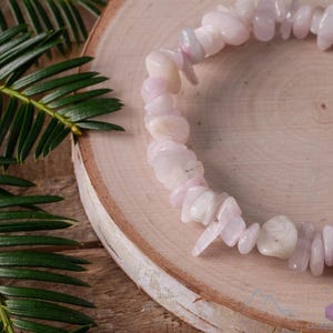 These pale pink Kunzite crystal bracelets have chip beads strung on elastic for an endless bracelet.  
Crystals are nature-made therefore each one is unique in appearance.