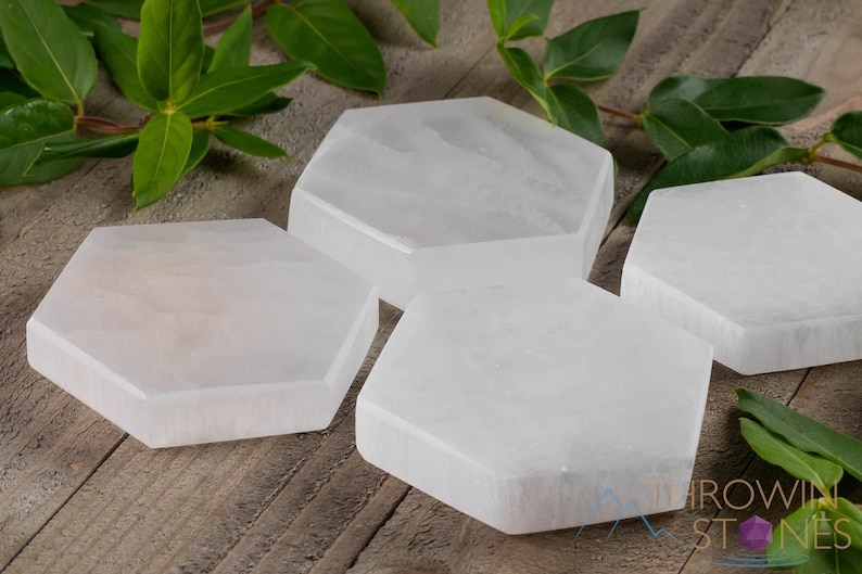 These are white Selenite crystal carved polished hexagon plates.
Crystals are nature-made therefore each one is unique in appearance.