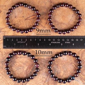 These maroon Garnet crystal bracelets have spherical beads strung on elastic for an endless bracelet.  
Crystals are nature-made therefore each one is unique in appearance.