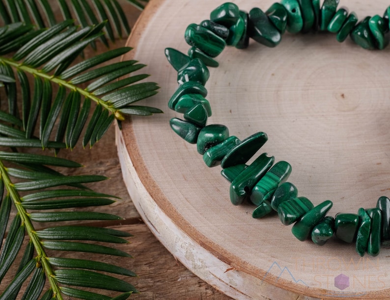 Handcrafted Malachite chip bracelet. These green, tumbled chips, are drilled, and strung on an elastic cord, to create an endless bracelet. Each crystal bracelet is unique in shape, and color, and has a wrist circumference of approximately 6 inches.