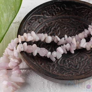These pale pink Kunzite crystal necklaces have crystal chip beads strung on beading cord for an endless necklace. 
Crystals are nature-made therefore each one is unique in appearance.