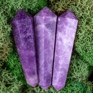 These Lepidolite crystal carved polished double terminated points range in a variety of handheld sizes.  Lepidolite  is mottled light to dark pinkish purple with white splotches.
Crystals are nature-made therefore each one is unique in appearance.