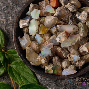 These raw Opal crystals are chunk shaped and rainbow colored with patches of tan matrix.
Crystals are nature-made therefore each one is unique in appearance.