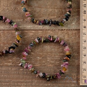 Handcrafted Tourmaline chip bracelet. These rainbow colored tumbled stones are drilled and strung on an elastic cord, to create an endless bracelet. Each crystal bracelet is unique in color, and has a wrist circumference of approximately 6 inches.