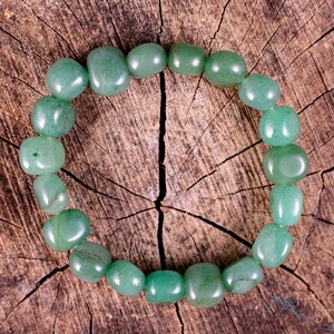 These pale Green Aventurine crystal bracelets have tumbled beads strung on elastic for an endless bracelet.  
Crystals are nature-made therefore each one is unique in appearance.