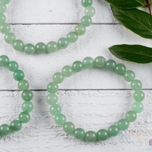These pastel green Aventurine crystal bracelets have sphere beads strung on elastic for an endless bracelet. 
Crystals are nature-made therefore each one is unique in appearance.
