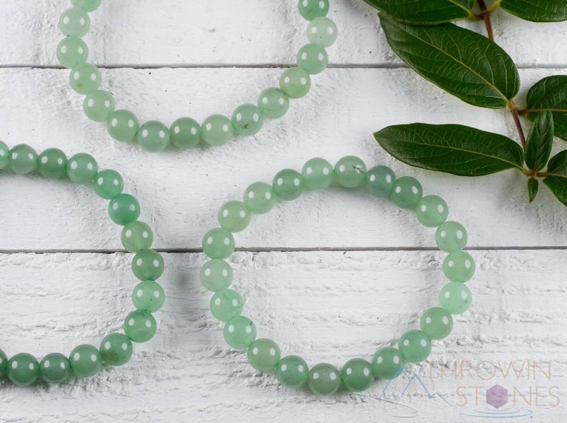 These pastel green Aventurine crystal bracelets have sphere beads strung on elastic for an endless bracelet. 
Crystals are nature-made therefore each one is unique in appearance.