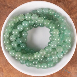 These pastel green Aventurine crystal bracelets have sphere beads strung on elastic for an endless bracelet. 
Crystals are nature-made therefore each one is unique in appearance.
