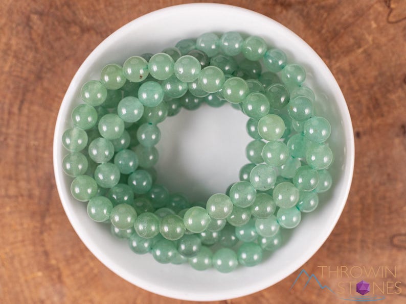 These pastel green Aventurine crystal bracelets have sphere beads strung on elastic for an endless bracelet. 
Crystals are nature-made therefore each one is unique in appearance.
