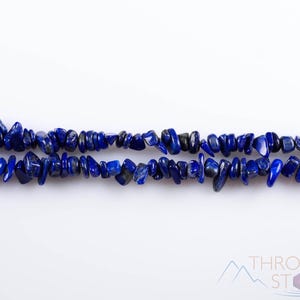 Handcrafted Lapis Lazuli chip necklace. These genuine, natural, tumbled chips, are drilled, and strung on elastic cord to create an endless necklace. This gemstone necklace is blue, weighs around 80 grams, and is approximately 34 inches in length.