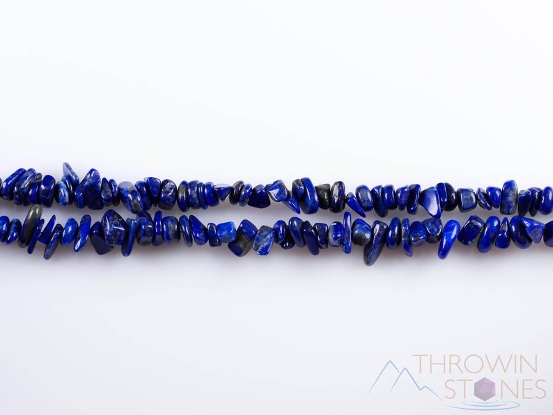 Handcrafted Lapis Lazuli chip necklace. These genuine, natural, tumbled chips, are drilled, and strung on elastic cord to create an endless necklace. This gemstone necklace is blue, weighs around 80 grams, and is approximately 34 inches in length.