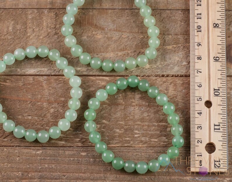 These pastel green Aventurine crystal bracelets have sphere beads strung on elastic for an endless bracelet. 
Crystals are nature-made therefore each one is unique in appearance.