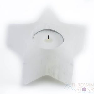 These are white Selenite crystal carved candle holders in the shape of a star.
Crystals are nature-made therefore each one is unique in appearance.