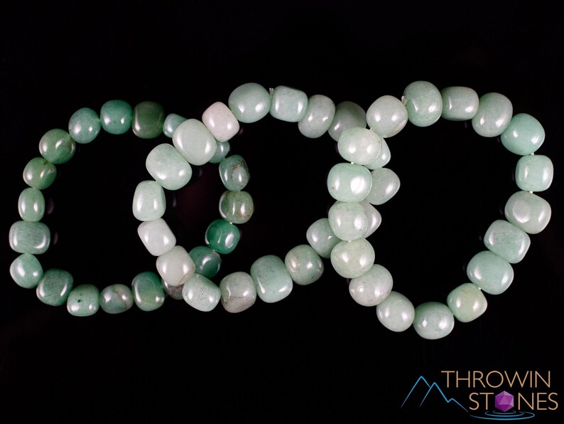 These pale Green Aventurine crystal bracelets have tumbled beads strung on elastic for an endless bracelet.  
Crystals are nature-made therefore each one is unique in appearance.