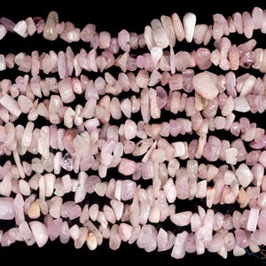 These pale pink Kunzite crystal necklaces have crystal chip beads strung on beading cord for an endless necklace. 
Crystals are nature-made therefore each one is unique in appearance.