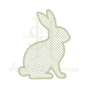 May include: A light green embroidered rabbit silhouette featuring a cross-hatch grid pattern throughout the body. The design is outlined with a solid stitch border, showcasing a seated bunny profile with long ears and a small tail in a flat style.