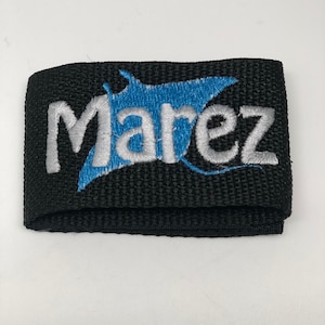 May include: Black strap with white embroidered text "Marez" and a blue stingray logo.