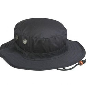 May include: A black, wide-brimmed hat with a round crown and a chin strap. The hat features two metal rivets on the crown and a drawstring with a wooden bead. The brim is slightly sloped.