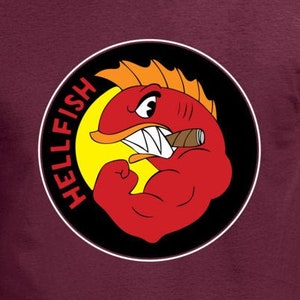 May include: Maroon t-shirt featuring a cartoon illustration of a red fish flexing its bicep, with the word "HELLFISH" in red text. The fish is set against a yellow background within a black circle.