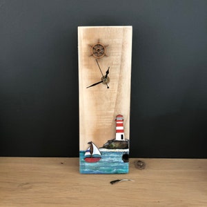 Lighthouse and boat clock