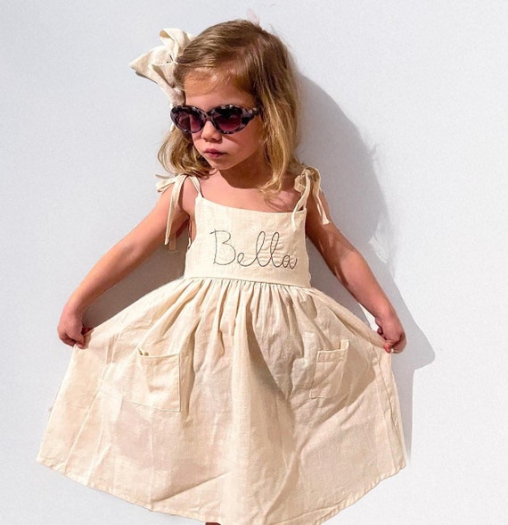 linen dress with bow The Aisle linen bow mini dress  Crafted in a luxurious yet effortless 100%  linen, made to enhance and not overwhelm.  Limited for pre-order online.   #DISSH #TheAisleEdit