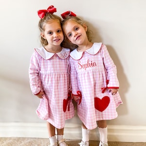 Girls Monogrammed Valentine&#39;s Day Peter Pan Collar Gingham Pink and Red Dress with Bow Details and Matching Hair Bow, Featuring a Heart