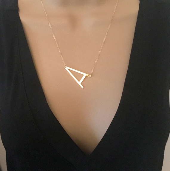 large sideways initial necklace gold