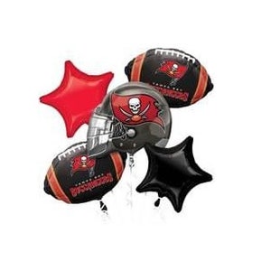 May include: A set of five foil balloons featuring the Tampa Bay Buccaneers logo. The set includes two football-shaped balloons, one helmet-shaped balloon, and two star-shaped balloons, one red and one black.