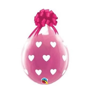 May include: A pink balloon with white hearts printed on it. The balloon is tied with a pink ribbon bow.