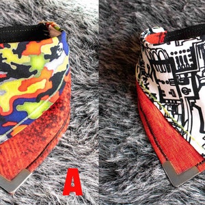 Pode incluir: Duas bandanas revers&iacute;veis para c&atilde;es. A primeira bandana &eacute; vermelha, amarela, verde e azul com um padr&atilde;o de caveira. A segunda bandana &eacute; branca com um design abstrato preto e branco. Ambas as bandanas t&ecirc;m um lado inferior vermelho.