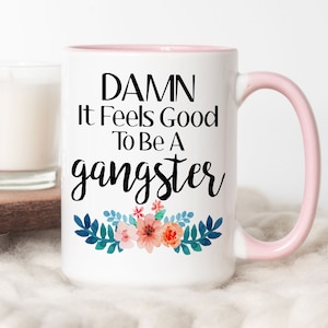 Damn It Feels Good To Be A Gangster Mug, Funny Coffee Mug, Damn It Feels Good To Be A Gangsta Mug, Birthday Gift For Her, Christmas Gift 15oz Pink Rim/Handle