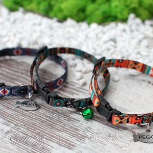 May include: Two colorful cat collars with adjustable buckles and a bell. One collar has a tag that says "MOLLY" and the other says "PEGGY".