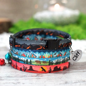 May include: A colourful cat collar with a mountain and forest design. The collar has a black buckle and a silver tag that says "Cliff".